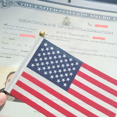 Picture of my US naturalization certificate with a US flag over it